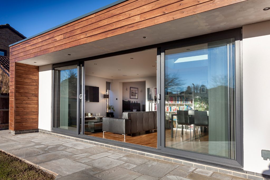an anthracite grey sliding patio door leading out onto a patio