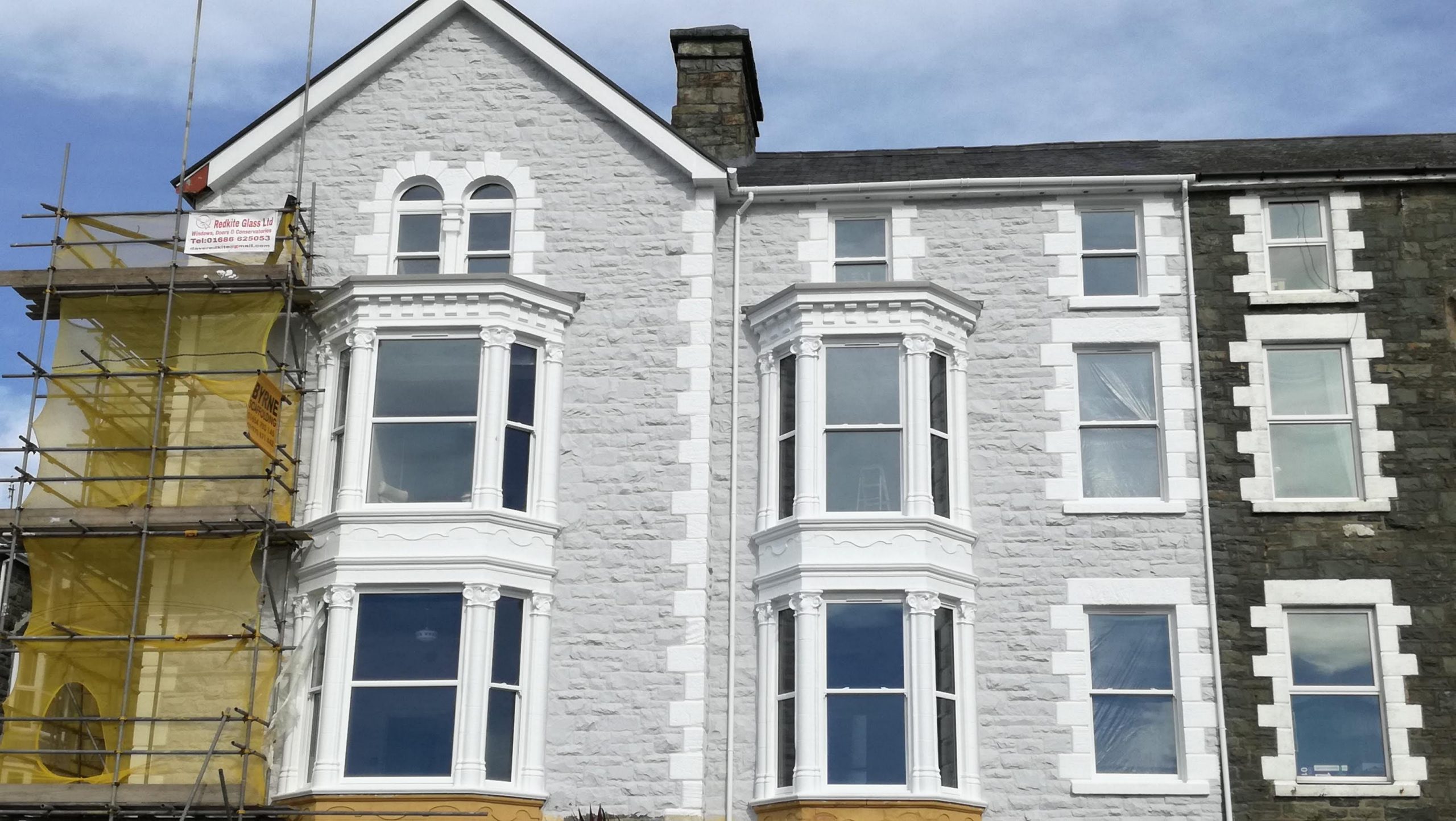 white sash windows fitted into a hotel