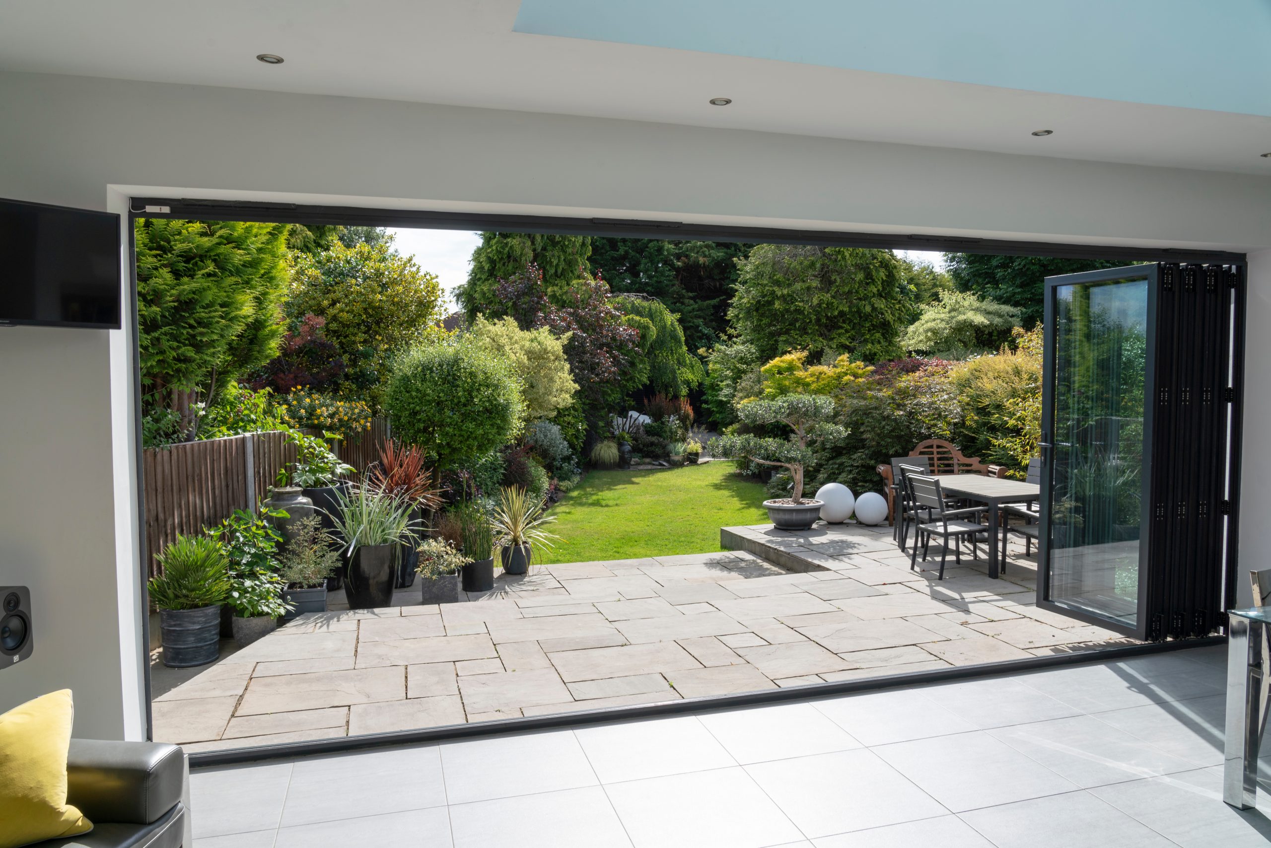 anthracite grey bi-folding doors leading out onto a patio