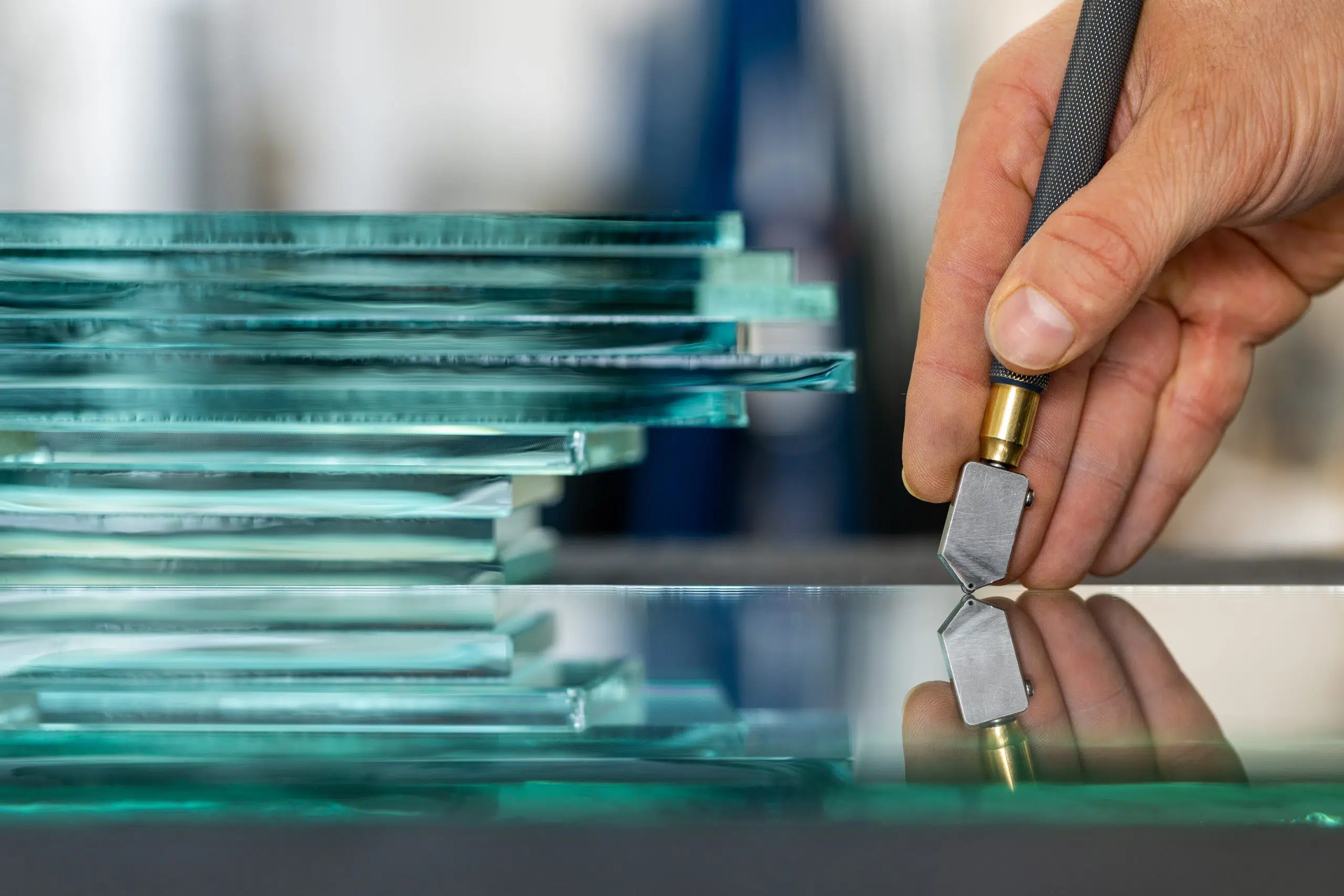 image showing someone cutting glass